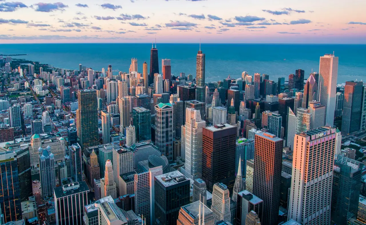 Aerial view of the Chicago skyline at dusk along Lake Michigan