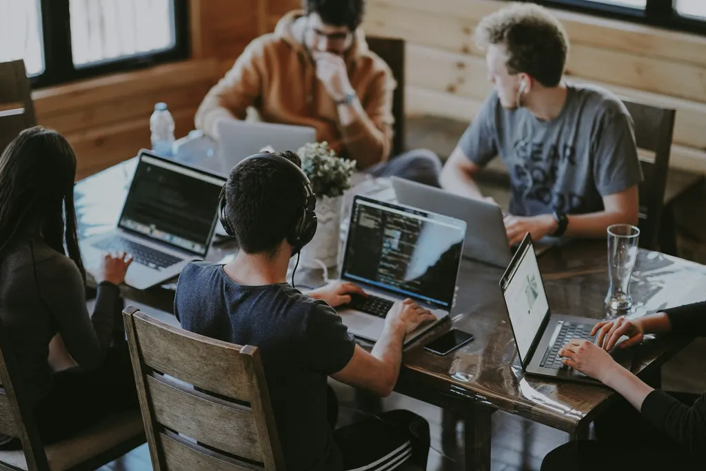 Engineers reviewing code together during a working session