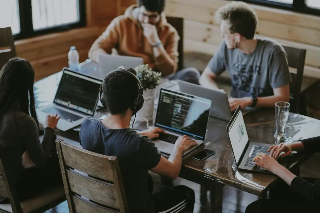 Engineers reviewing code together during a working session